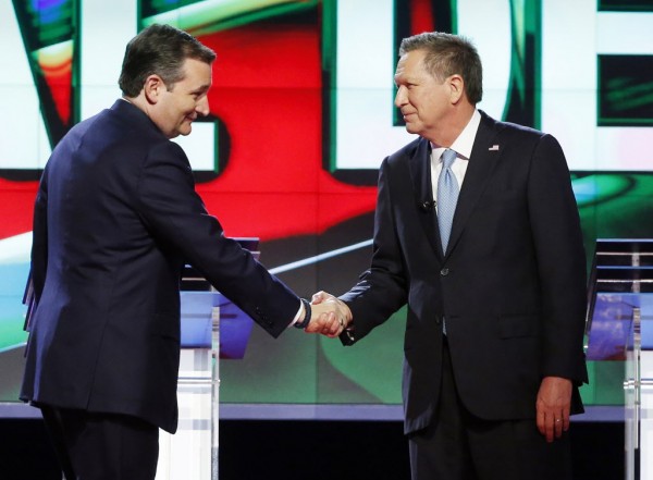 Republican presidential candidate, Sen. Ted Cruz, R-Texas, left, shakes hands with Republican presidential candidate, Ohio Gov. John Kasich, at the start of the Republican presidential debate sponsored by CNN, Salem Media Group and the Washington Times at the University of Miami, Thursday, March 10, 2016, in Coral Gables, Fla. (AP Photo/Wilfredo Lee)