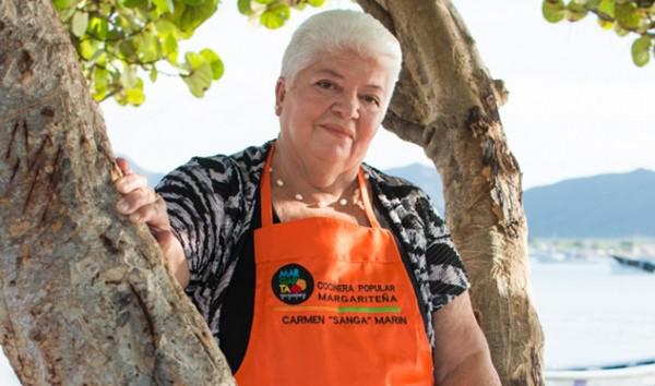 Este año la fiesta culinaria estará dedicada a la cocinera popular Carmen “Sanga” Marín, quien tiene 45 años en los fogones del restaurante El Bonguero en Juan Griego. Foto: Cortesía.