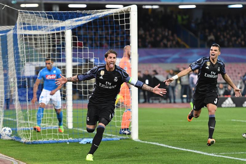 Dos goles de cabeza del central y uno de Morata guiaron la victoria del conjunto blanco sobre el Napoli (1-3) y sellar su pase a la siguiente fase