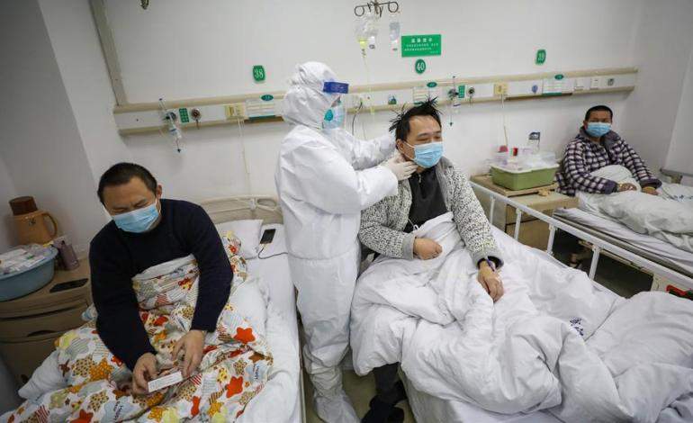 Nuevos criterios elevan casos de Covid-19 en China